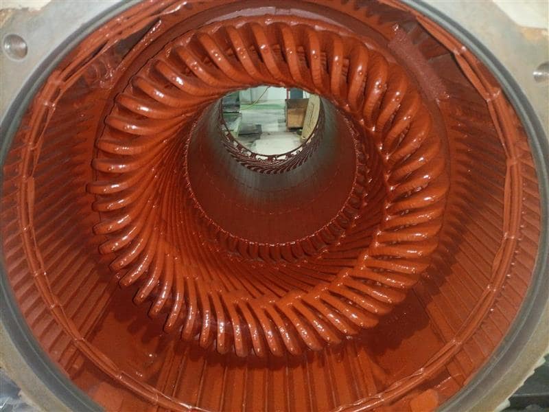 Freshly rewound stator with new coils and red insulation